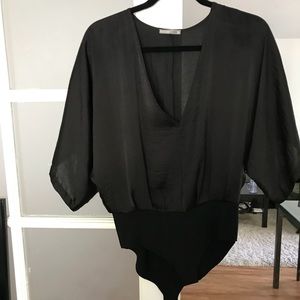 Silky black bodysuit from Zara